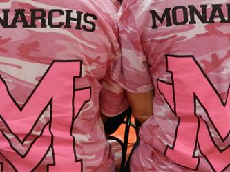 2 Students wearing Pink Monarchs Shirts